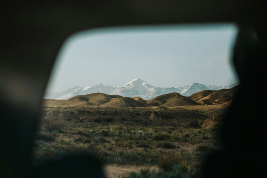 snow-capped-mountains-viewed-through-a-car-window-.jpg Snow-capped mountains viewed through a car window.